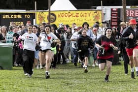 Festival goers run into the main arena, as the gates open for music fans to get a good place to watch their favourite artists throughout the day. Leeds Festival 2023 day 1 starts, in West Yorkshire, and will run until Sunday, pictured in West Yorks, Aug 25 2023.