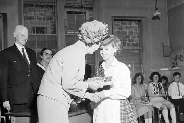 Dux Girl Allison Blacklaws receives her prize at Liberton Primary School's end of term prizegiving in June 1965.
