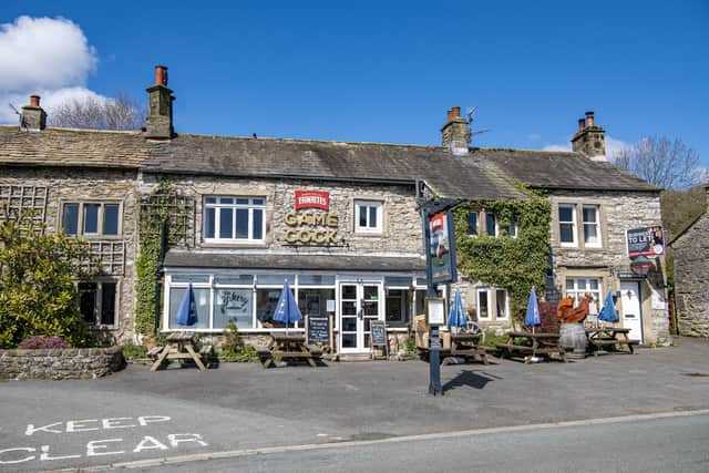 A village essential, The Game Cock pub in Austwick in the Yorkshire Dales National Park, photographed by Tony Johnson for The Yorkshire Post.  25th April 2023