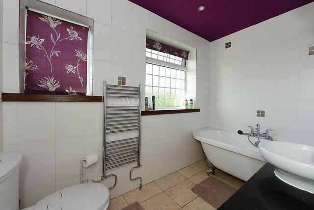 The striking family bathroom features a double-ended bath with mixer tap, wash hand basin with mixer tap, and low-level WC. A fully tiled wall, spotlighting and a heated towel-rail add to the room's panache. If you fancy a shower, nip to the downstairs wet room.