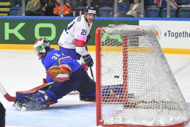 TAKE THAT: Mike Hammond shows neat skill to backhand past Italy netminder Justin Fazio to amke it 3-2 to Great Britain at Nottingham's Motorpoint Arena. Picture courtesy of Karl Denham/Ice Hockey UK