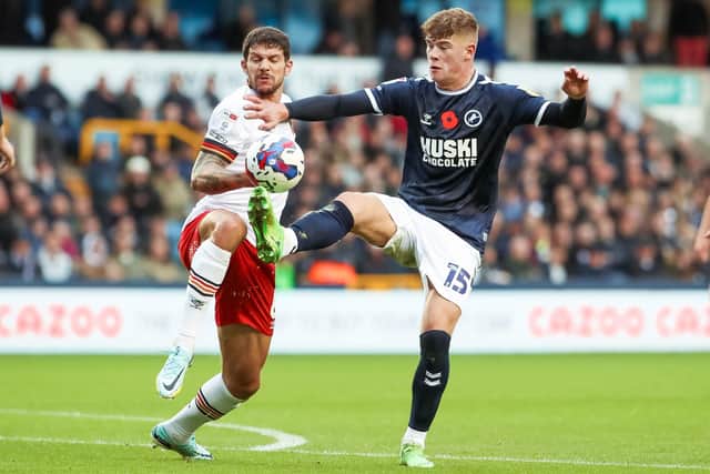 STALEMATE: Millwall's Charlie Cresswell comes under pressure from Hull City at The Den. Picture: Rhianna Chadwick/PA.