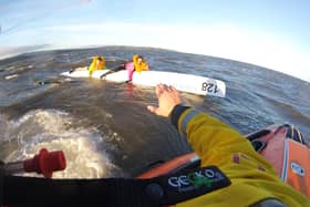 Rowers being rescued by Whitby RNLI crew. Credit: RNLI