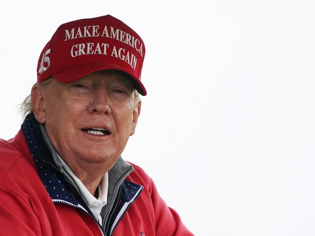 Former US president Donald Trump wearing a cap with his 'Make America Great Again' slogan. PIC: Brian Lawless/PA Wire