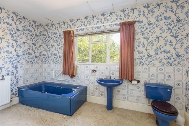 A blue bathroom suite which could be kept or changed.