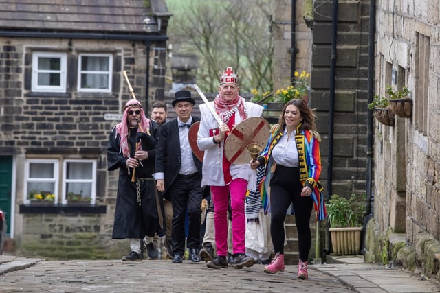 The cast of the Heptonstall Pace Egg make their way to Weavers Square.