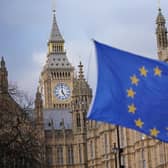 A European Union flag flies in front of the Houses of Parliament in Westminster, London. PIC: PA