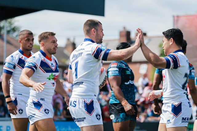 Wakefield celebrate Max Jowitt's early try. (Photo: Alex Whitehead/SWpix.com)