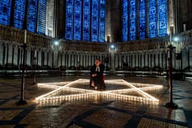 The Reverend Canon Michael Smith, Acting Dean of York, lighting candles at York Minster commemorating Holocaust Memorial Day last year. PIC: James Hardisty