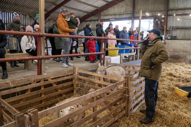 John Warters speaks to visitors during lambing at Humble Bee Farm