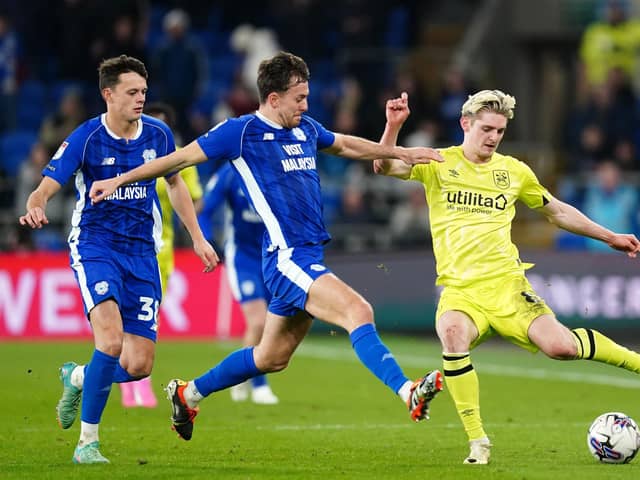 Huddersfield Town's Jack Rudoni and Cardiff City's Ryan Wintle battle for the ball during the Sky Bet Championship match at the Cardiff City Stadium. Picture: David Davies/PA Wire.