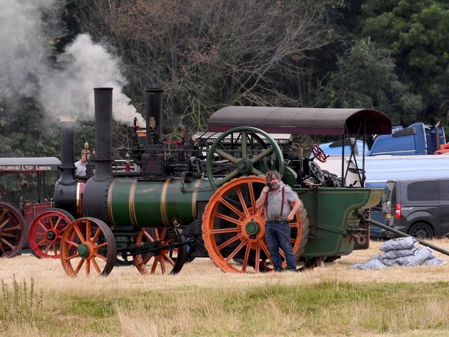 An exhibitor takes a well-earned break beside his steam engine during the 59th Masham Steam Engine and Fair Organ Rally