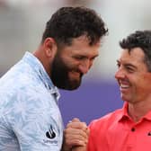 Best of rivals: Jon Rahm of Spain and Rory McIlroy of Northern Ireland shake hands on the 18th green following their opening round at the DP World Tour Championship (Picture: Andrew Redington/Getty Images)