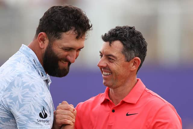 Best of rivals: Jon Rahm of Spain and Rory McIlroy of Northern Ireland shake hands on the 18th green following their opening round at the DP World Tour Championship (Picture: Andrew Redington/Getty Images)