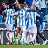 Huddersfield Town head coach Andre Breitenreiter celebrates with his players after Rhys Healey's dramatic late winner against Championship relegation rivals Millwall. Picture: Bruce Rollinson.