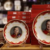 King Charles III plates for sale ahead of his Coronation. (Pic credit: Hollie Adams / Getty Images)