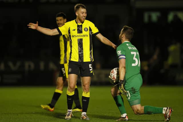 Harrogate Town's Jasper Moon (left) and goalkeeper James Belshaw celebrate at the end of the match after the Emirates FA Cup first round match at The Exercise Stadium, Harrogate. Picture date: Sunday November 3, 2024. PA Photo. See PA story SOCCER Harrogate. Photo credit should read: Richard Sellers/PA Wire.RESTRICTIONS: EDITORIAL USE ONLY No use with unauthorised audio, video, data, fixture lists, club/league logos or "live" services. Online in-match use limited to 120 images, no video emulation. No use in betting, games or single club/league/player publications.