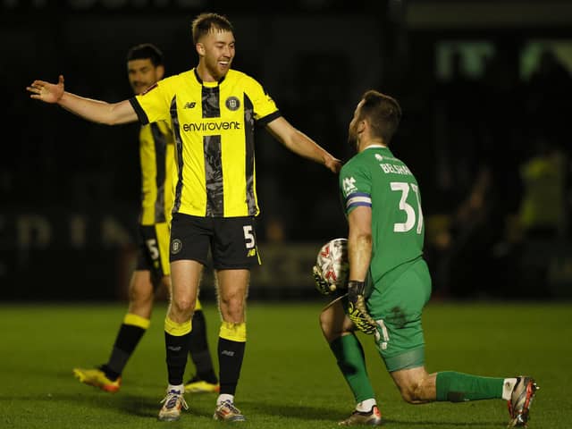 Harrogate Town's Jasper Moon (left) and goalkeeper James Belshaw celebrate at the end of the match after the Emirates FA Cup first round match at The Exercise Stadium, Harrogate. Picture date: Sunday November 3, 2024. PA Photo. See PA story SOCCER Harrogate. Photo credit should read: Richard Sellers/PA Wire.RESTRICTIONS: EDITORIAL USE ONLY No use with unauthorised audio, video, data, fixture lists, club/league logos or "live" services. Online in-match use limited to 120 images, no video emulation. No use in betting, games or single club/league/player publications.