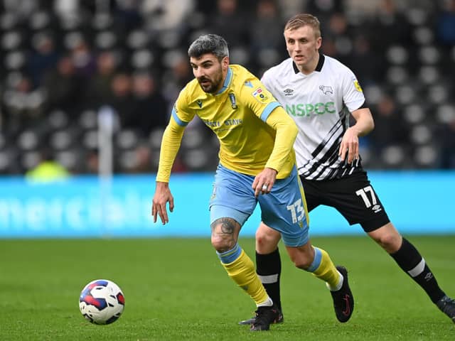 DERBY, ENGLAND - DECEMBER 03: Callum Paterson of Sheffield Wednesday gets past Louie Sibley of Derby during the Sky Bet League One between Derby County and Sheffield Wednesday at Pride Park Stadium on December 03, 2022 in Derby, England. (Photo by Gareth Copley/Getty Images)