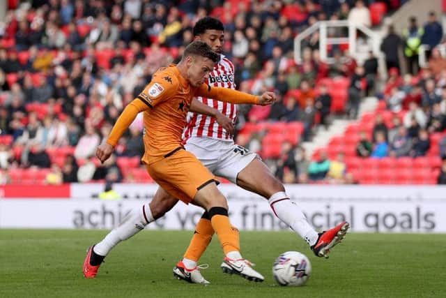 : Josh Laurent of Stoke City blocks a shot by Regan Slater of Hull City. (Photo by Charlotte Tattersall/Getty Images)