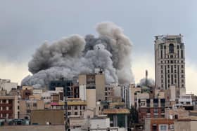A plume of smoke rises after a strike in Tehran, Iran earlier this week. (Picture: AP/Mohsen Ganji)