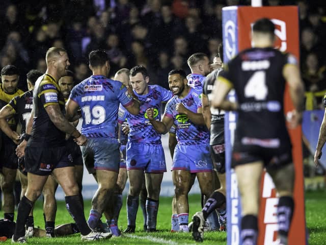 Wigan celebrate Patrick Mago's opening try after being given a scare by Castleford. (Photo: Allan McKenzie/SWpix.com)