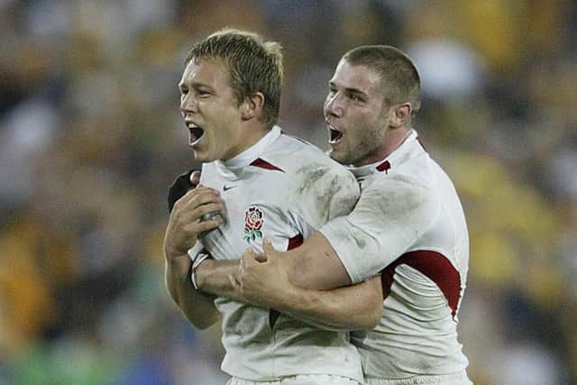 English fly-half Jonny Wilkinson (L) and winger Ben Cohen celebrate after winning the Rugby World Cup final between Australia and England, 22 November 2003 at Olympic Park Stadium in Sydney.  (Picture: DAMIEN MEYER/AFP via Getty Images)