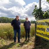 Steve Hogg, a dairy farmer, and sheep secretary/steward for Borrowby Show pictured with Lester Peel and show sign.
