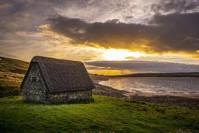 The sunsets over High Laith cruck barn on the shores of Grimwith Reservoir near Grassington. The 16th century barn was moved and restored to preserve it and of a type which in rarely seen in the dales. Picture Tony Johnson