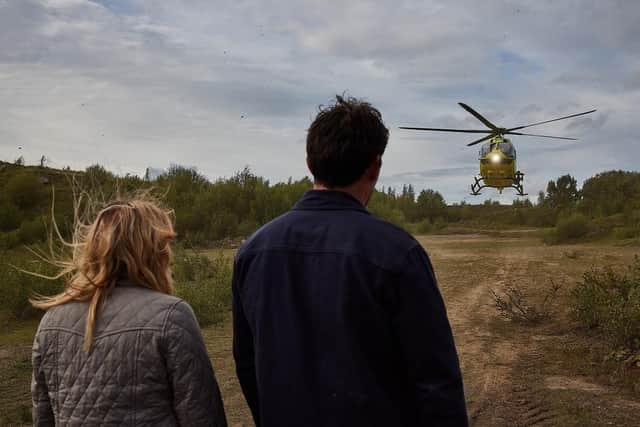 Charity Dingle and Mackenzie Boyd waiting for the helicopter on Emmerdale. (Pic credit: Yorkshire Air Ambulance)
