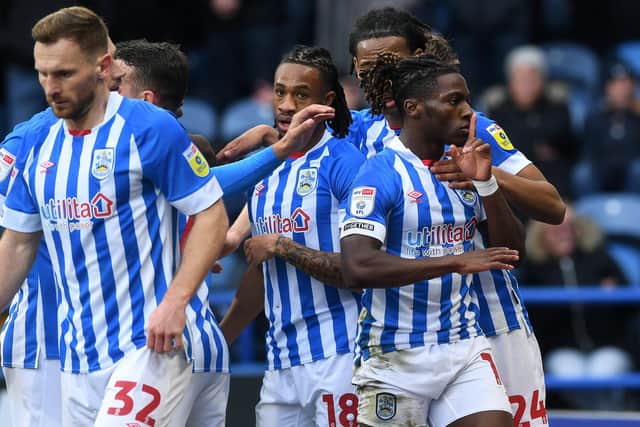 UP AND RUNNING: Joseph Hungbo celebrates Huddersfield Town's first goal of Neil Warnock's second spell, and the on-loan winger's first for the club