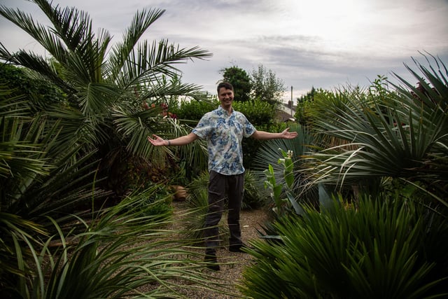 Kris Swaine, 41, Cafe Manager from Wakefield, Yorkshire, in his tropical garden.