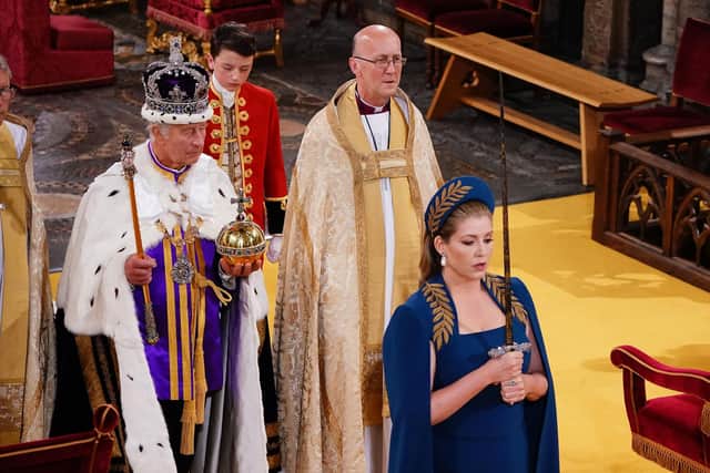 Penny Mordaunt, holding the Sword of State walking ahead of King Charles III during his coronation ceremony in Westminster Abbey.