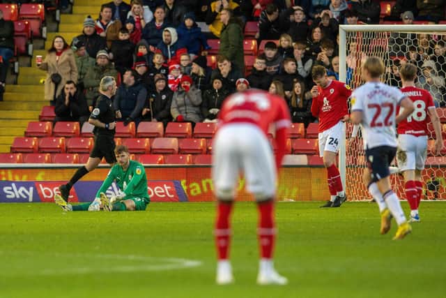 Barnsley goalkeeper Brad Collins appears dejected after Bolton's second goal. (Picture by Bruce Rollinson)