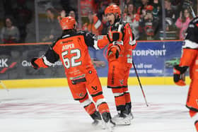 SHEFFIELD EXPECTS: Sheffield Steelers' Ryan Tait celebrates scoring against Glasgow Clan with line-mate Evan Jasper - the pair part of an effective combination with centre Adam Rockwood. Picture: Cerys Heslop/Steelers Media.