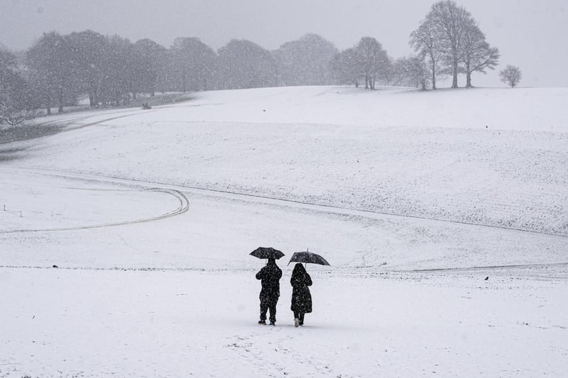 Snow battered down on Leeds, but one couple still enjoyed a walk.
