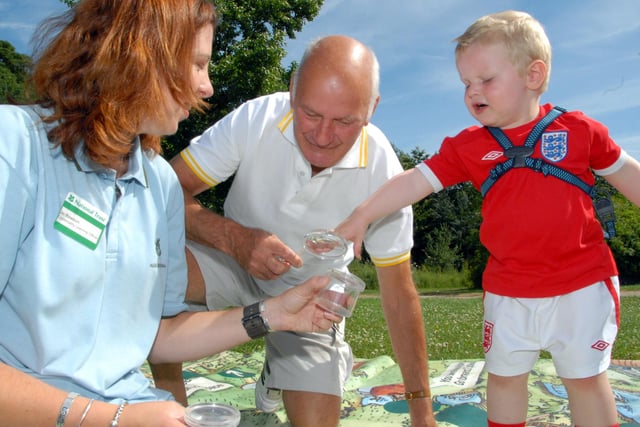 Two-year-old Finley Hollingworth, right, from Sutton and his Great-Grandad Michael Hollerway lookings at bugs with Jo Rawson, left a Community Learning Officer from Hardwick Hall back in 2010