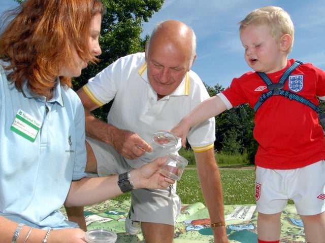 Two-year-old Finley Hollingworth, right, from Sutton and his Great-Grandad Michael Hollerway lookings at bugs with Jo Rawson, left a Community Learning Officer from Hardwick Hall back in 2010