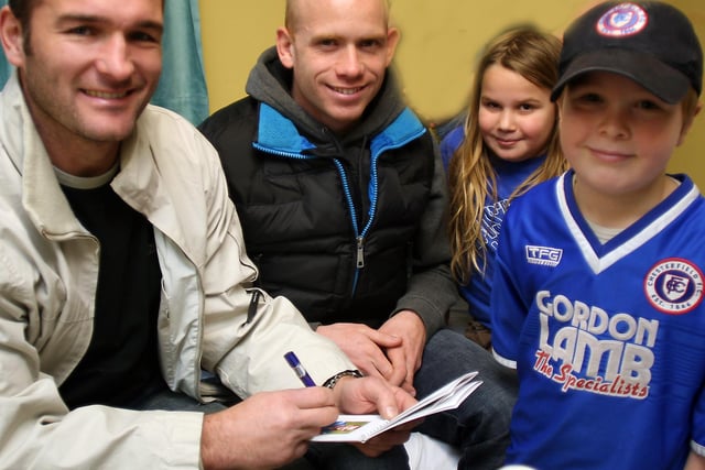 Chesterfield footballers  Kevin Gray and Derek Niven meet Stan and Poppy Tomkinson on a visit to Chesterfield Royal Hospital's Nightingale ward.