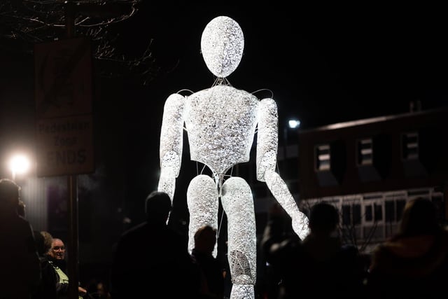 A giant, illuminated puppet at the event.