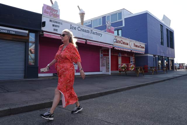 A woman walking. PIC: Jonathan Brady/PA Wire