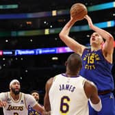 Denver Nuggets star Nikola Jokic #15rises above LeBron James of the LA Lakers during the Western Conference finals (Picture: Getty Images)