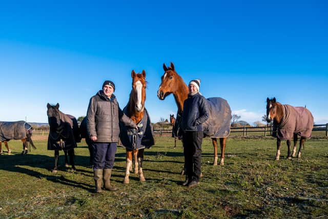 Racehourse trainer Neville Ender, of Swallows Barn, East Heslerton, Malton, North Yorkshire, with his daughter Sara, aged 34, and some of the racehorses.