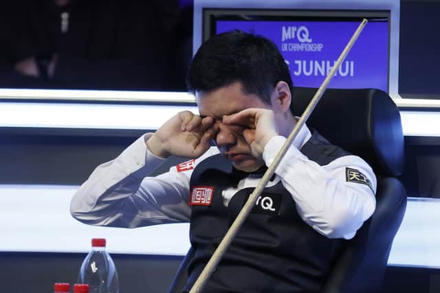 Ding Junhui rubs his eyes during his match against Mark Allen (not pictured) on day one of the MrQ UK Championship 2023 at York Barbican. Picture date: Saturday November 25, 2023. PA Photo. See PA story SNOOKER York. Photo credit should read: Richard Sellers/PA WireRESTRICTIONS: Use subject to restrictions. Editorial use only, no commercial use without prior consent from rights holder.