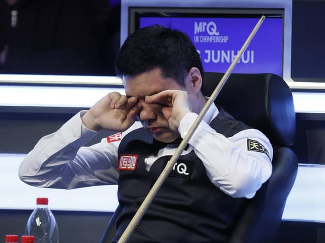 Ding Junhui rubs his eyes during his match against Mark Allen (not pictured) on day one of the MrQ UK Championship 2023 at York Barbican. Picture date: Saturday November 25, 2023. PA Photo. See PA story SNOOKER York. Photo credit should read: Richard Sellers/PA Wire

RESTRICTIONS: Use subject to restrictions. Editorial use only, no commercial use without prior consent from rights holder.