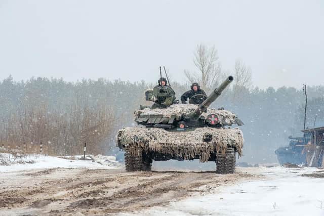 Ukrainian troops in an army tank. (Pic credit: Sergey Bobok / AFP via Getty Images)