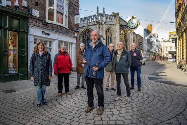 Members of the York Clock Group Yvonne Harmer, Andy Robertson, John Cossins, Mike Waters, Edward Bacon, Tony Rugg and Ken Pickering on Coney Street by the clock of St Martin's church photographed for The Yorkshire Post Magazine by Tony Johnson.