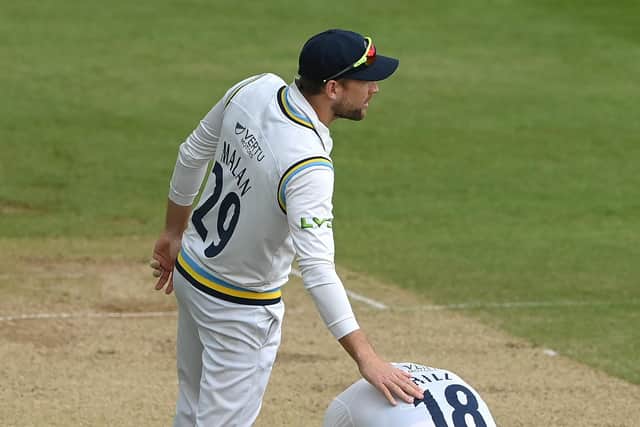 TOUGH DAY: George Hill is consoled by Yorkshire CCC team-mate Dawid Malan after Durham won in thrilling fashion. Picture: Stu Forster/Getty Images.