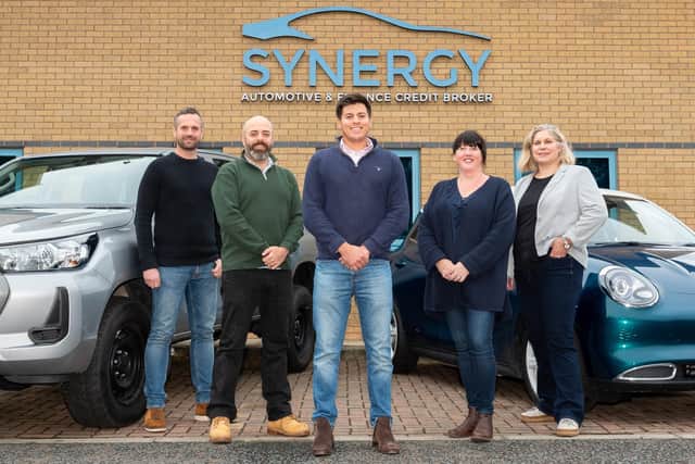 Phil Reynolds, managing director of Newable, centre, with the Synergy Car Leasing leadership team.