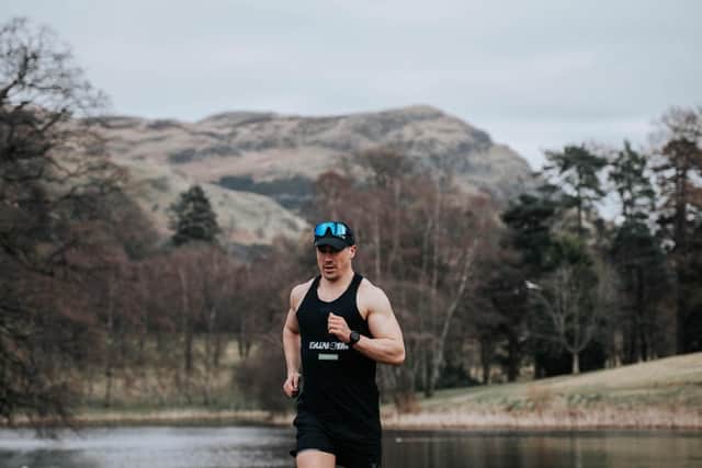 Josh Patterson runs in the countryside during one of his marathons.